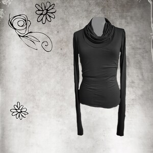 May include: A black long-sleeved shirt with a cowl neck.