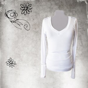 May include: White long-sleeved v-neck shirt with a fitted silhouette.