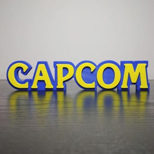 Capcom Logo Sign ~8.25in Video Game Decor (3D printed, gamer, game room, gaming, gift, decor, videogame, retro, shelf display)