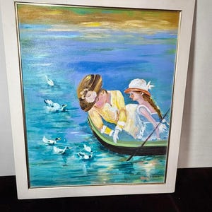 May include: Oil painting in a white frame depicts two figures in a boat on a blue lake with ducks. One figure wears a yellow dress and large hat, the other a white dress and hat. The sky is gold and blue.