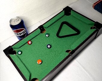 Billar de mesa en su caja original.