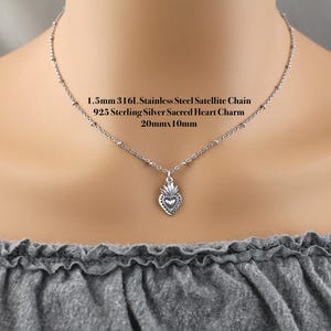 Sterling Silver Dainty 20x10mm sacred heart charm on a 316L stainless steel 1.5mm satellite chain.