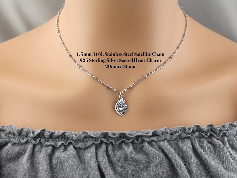 Sterling Silver Dainty 20x10mm sacred heart charm on a 316L stainless steel 1.5mm satellite chain.