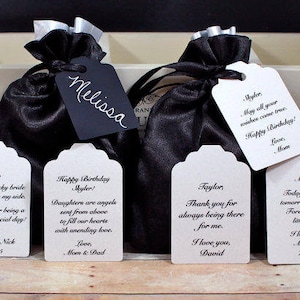 May include: Five white gift tags with black text. The tags have different messages, including "Happy Birthday Skyler!" and "Thank you for always being there for me."