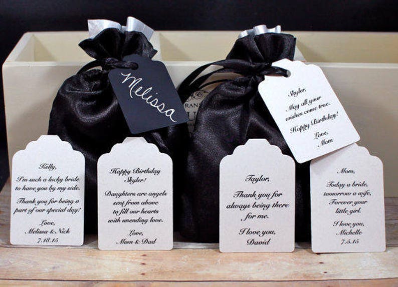 May include: Five white gift tags with black text. The tags have different messages, including "Happy Birthday Skyler!" and "Thank you for always being there for me."