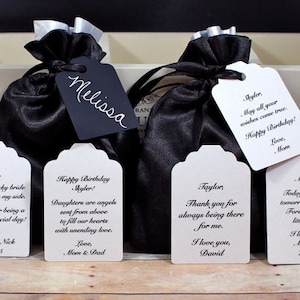 May include: Six white gift tags with black text. The tags have different messages, including "Happy Birthday Skyler!" and "Thank you for always being there for me."