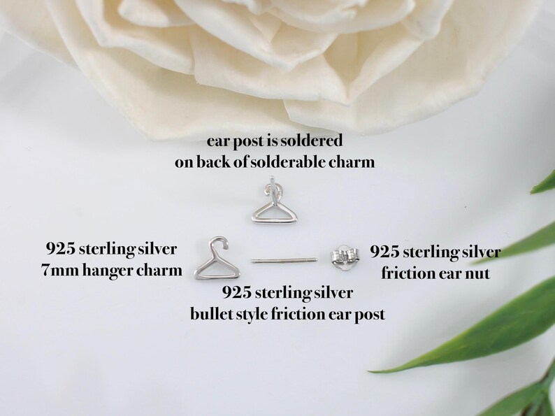 May include: A close-up of a 925 sterling silver hanger charm earring. The earring features a 7mm hanger charm, a bullet style friction ear post, and a friction ear nut. The ear post is soldered to the back of the charm.