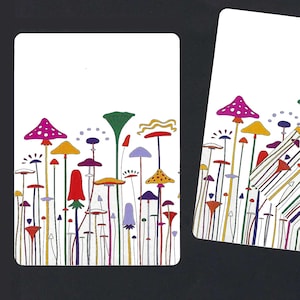 May include: Three white rectangular cards with a colorful mushroom illustration. The mushrooms have red, purple, yellow, and green caps with various patterns. The stems are thin and multi-colored, set against a dark background.