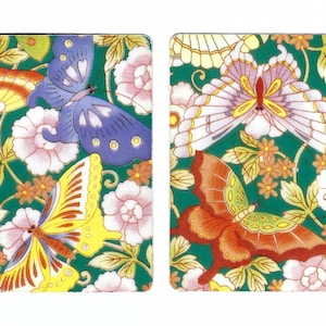 May include: Two rectangular panels featuring a vibrant green background with a repeating pattern of pink flowers and green leaves. The left panel displays a blue butterfly and a yellow butterfly. The right panel shows a white butterfly and a red butterfly.