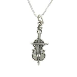 May include: A silver necklace featuring a cello pendant. The cello is detailed with strings and a bridge.