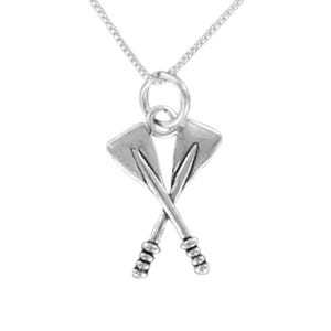 May include: A silver-toned necklace featuring a pendant shaped like two crossed rowing oars. The pendant hangs from a delicate silver-toned chain by a circular jump ring. The oars have detailed handles and flat blades, creating a symmetrical design.