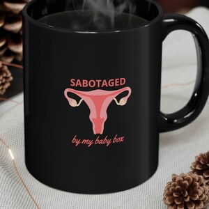 New Girl Mug - Sabotaged By My Baby Box - Uterus - Jessica Day - Black mug 11oz