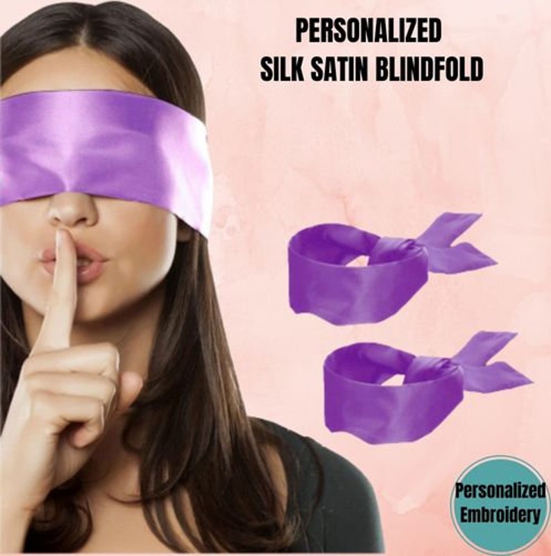 May include: A woman wearing a purple silk satin blindfold with the text "PERSONALIZED SILK SATIN BLINDFOLD". Two additional purple blindfolds with bow details are also shown. The image has a pink background.