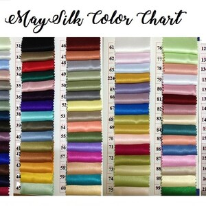 May include: A color chart labeled "May Silk Color Chart" displays numerous fabric swatches in a variety of colors. The swatches are arranged in rows and columns, showcasing a wide spectrum of hues, from pastels to vibrant shades.