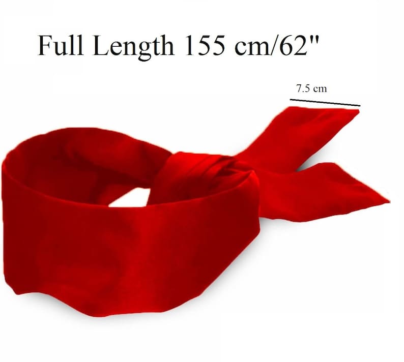May include: A vibrant red satin blindfold with a full length of 62 inches and a width of 3 inches. The blindfold is tied in a knot, with the ends fanning out. The text "Full Length 155 cm/62" is visible.