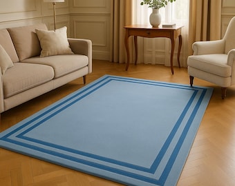 Alfombra de lana tejida a mano: moderna alfombra minimalista con borde azul.