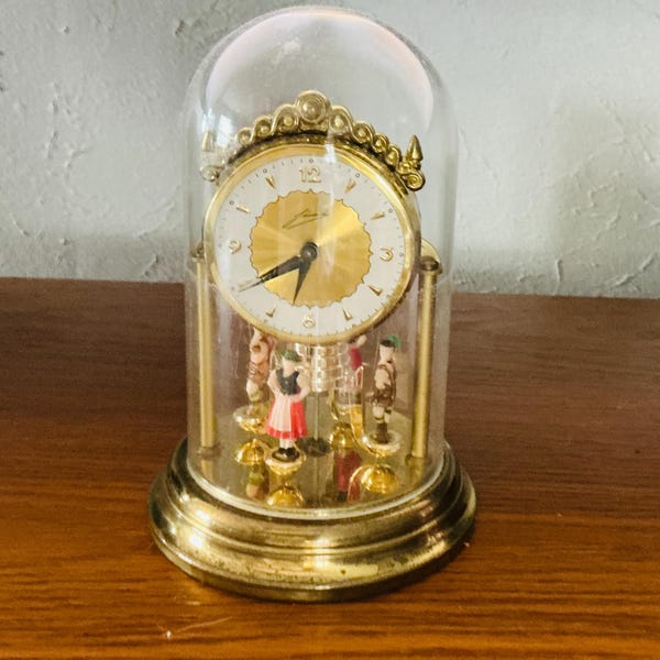 Relógio de mesa vintage Schmid, com mecanismo de corda e dançarinos giratórios, 15 cm (6 polegadas). Funciona perfeitamente!