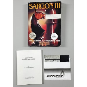 May include: A box for the Sargon III computer chess game. The box features a wooden chess knight on a chessboard. The text on the box reads "Sargon III", "The Ultimate in Computer Chess", and "Hayden Software".