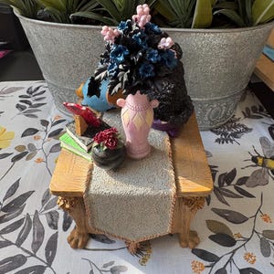 May include: A set of three ceramic mugs with a speckled, matte finish. The mugs are in shades of cream, light gray, and dark gray. Each mug has a simple, minimalist design, perfect for coffee or tea.