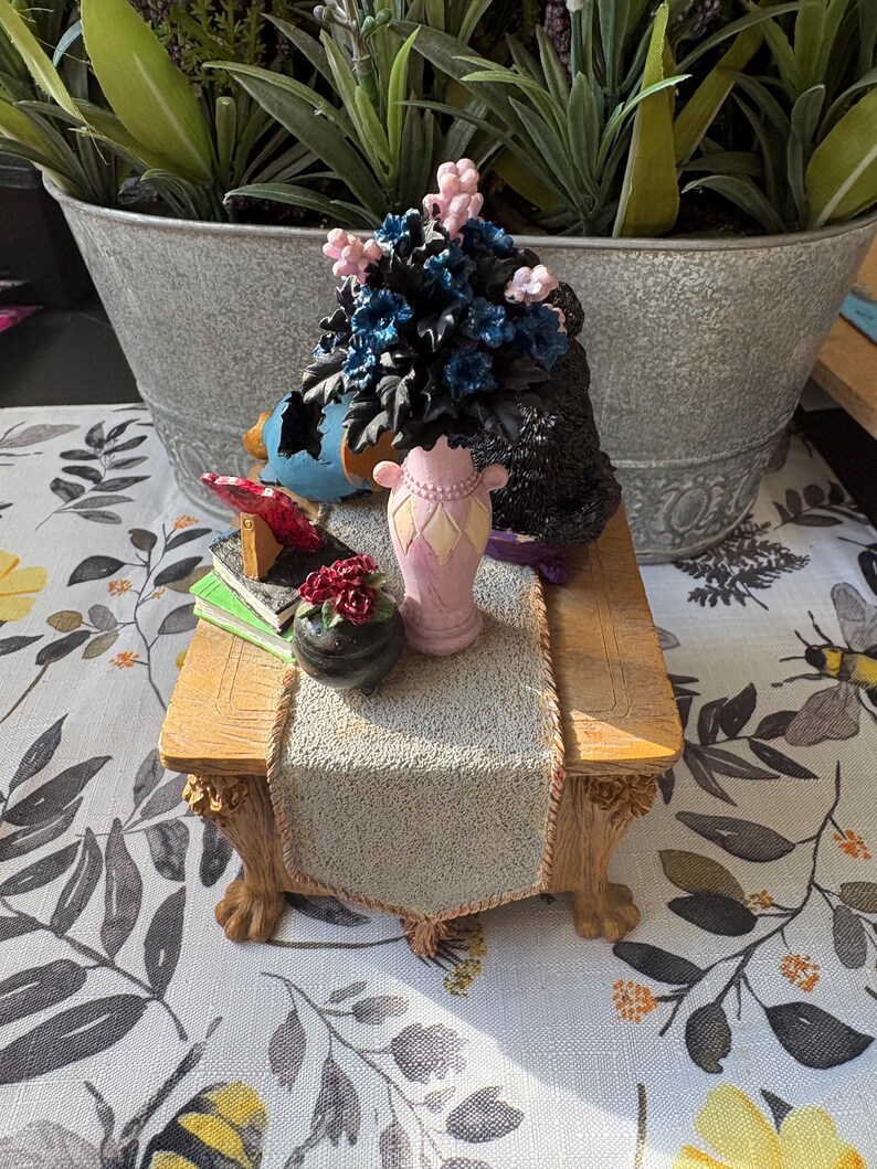 May include: A set of three ceramic mugs with a speckled, matte finish. The mugs are in shades of cream, light gray, and dark gray. Each mug has a simple, minimalist design, perfect for coffee or tea.