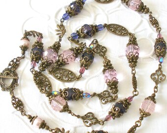 long statement necklace in pink and purple, layering necklace