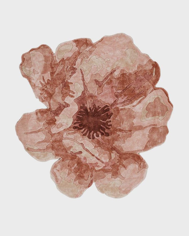 May include: A set of three ceramic mugs with a speckled, matte finish. The mugs are in shades of cream, light gray, and dark gray. Each mug has a simple, minimalist design, perfect for coffee or tea.