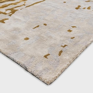 May include: A set of three ceramic mugs with a speckled, matte finish. Each mug features a different color: light blue, cream, and gray. The mugs have a simple, modern design, perfect for coffee or tea.