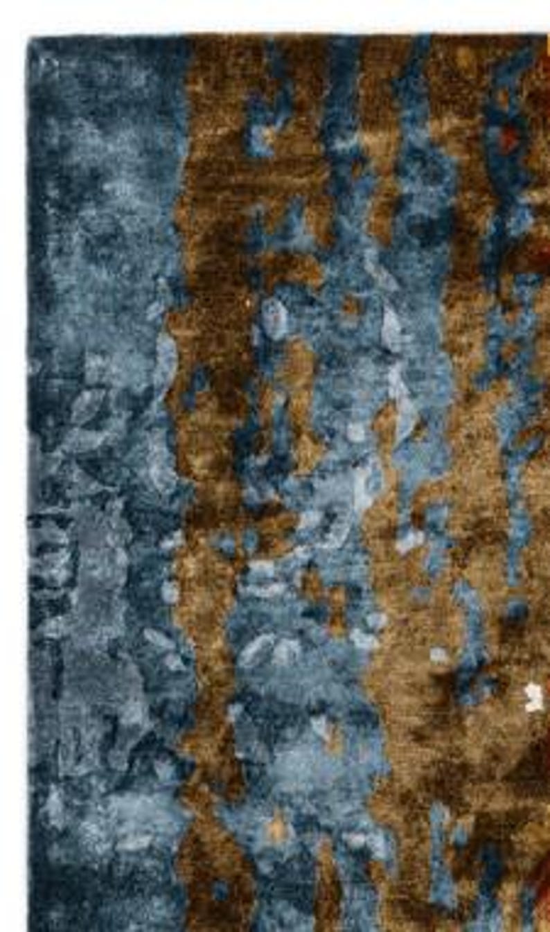 May include: A set of three ceramic mugs with a speckled, matte finish. The mugs are in shades of cream, light brown, and dark brown. Each mug has a simple, minimalist design, perfect for coffee or tea.