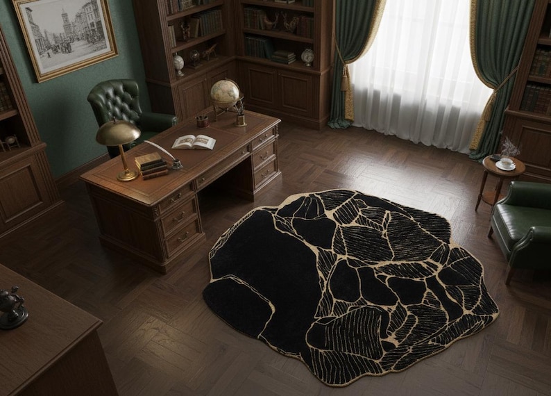 May include: An overhead view of a classic study with a large black rug with a beige, cracked pattern. The room features a wooden desk, bookshelves, and a green leather chair. A gold lamp sits on the desk.