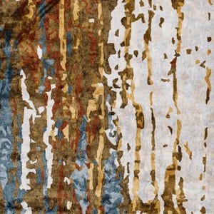 May include: Abstract area rug with a distressed design. The rug features a mix of colors, including brown, beige, blue, and rust. The design has vertical and horizontal elements, creating a textured appearance. The rug is suitable for living rooms and bedrooms.