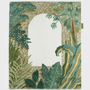 May include: A rectangular rug featuring a botanical design with an archway. The rug showcases lush green and yellow foliage, including palm trees and large leaves, framing a central white space. The border has a textured, stone-like appearance.
