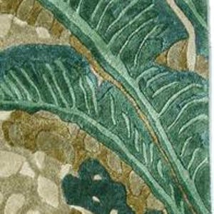 May include: A rectangular rug with a botanical design. The rug features large, stylized green leaves against a background of beige and brown organic shapes. The leaves have detailed veining, and the overall texture appears plush.