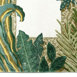 May include: Watercolor illustration of tropical foliage in shades of green, yellow, and brown. The leaves and plants frame a white rectangular space. The artwork has a textured appearance.