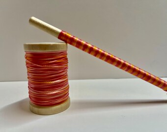 hand dyed orange and yellow  bonded nylon oboe thread. 100 yards