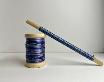 Purple and teal and blue bonded nylon oboe thread. 100 yards