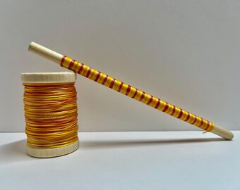 hand dyed yellow and quartz  bonded nylon oboe thread. 100 yards