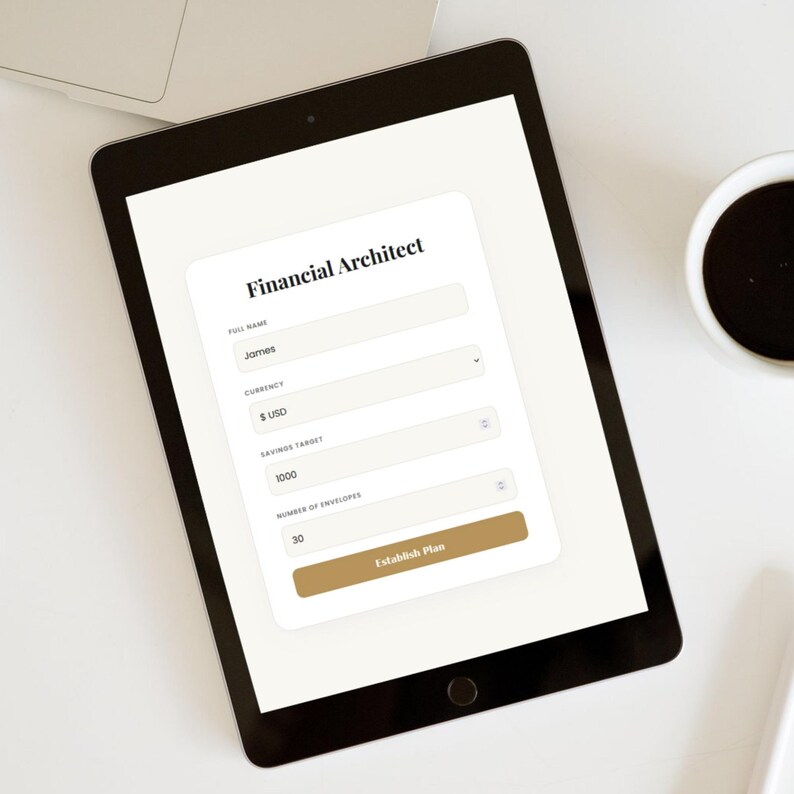 May include: A black tablet displays a financial planning form titled "Financial Architect." The form includes fields for full name, currency, savings target, and number of envelopes. A cup of coffee sits to the right. The screen shows the name "James" and a savings target of 1000.
