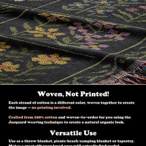 May include: A dark gray woven throw blanket with a floral pattern in yellow, pink, and blue. The blanket has a fringed edge with multiple colors. The text "Woven, Not Printed!" is visible.