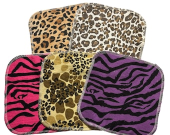 May include: Five reusable makeup remover pads featuring various animal print designs. The pads are crafted from soft, absorbent fabric and are ideal for removing makeup and cleansing the skin.