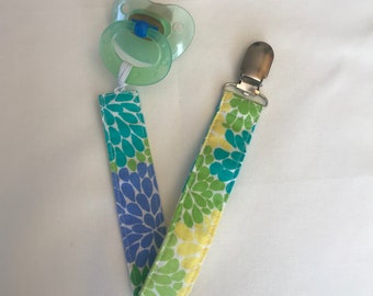 Clip de chupete azul, verde, amarillo Blooms
