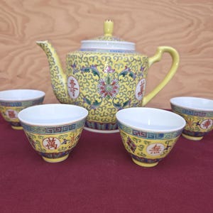 Vintage Chinese Mun Shou Longevity teapot and 4 cups