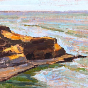 May include: Oil painting of a coastal landscape featuring a rocky cliffside and ocean waves. The cliff is painted in shades of brown and gold, with the ocean in shades of blue and green. The sky is a pale blue.