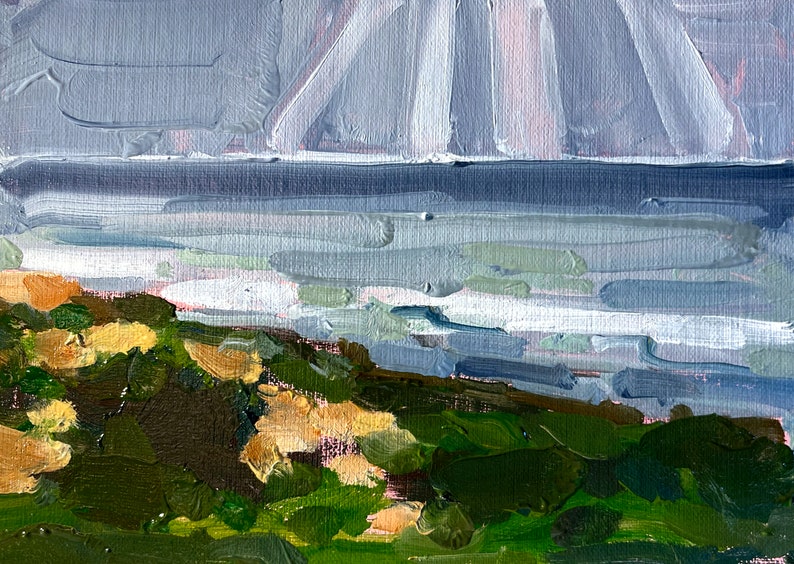 May include: Impressionistic oil painting of a coastal landscape. The artwork depicts a shoreline with green and tan foliage, a blue-gray sea, and a cloudy sky. The brushstrokes are visible, creating a textured effect.