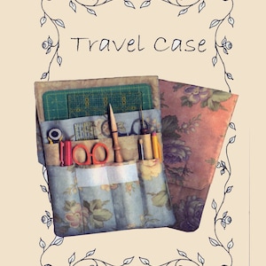 May include: A floral fabric travel case with multiple pockets and compartments for sewing supplies. The case is open and shows a variety of tools, including scissors, pencils, and a ruler. The case is labeled "Travel Case" and "Item # P3-116".