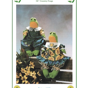 Może przedstawiać: Wzór szycia dla dwóch 40,6 cm lalek żab z wiejskiego krajobrazu. Wzór nosi nazwę "Dinglehoppers!" i numer wzoru to 139. Wzór nosi tytuł "Needle in a Haystack!!" i jest chroniony prawami autorskimi przez Bonnie Hunter w 1993 roku.