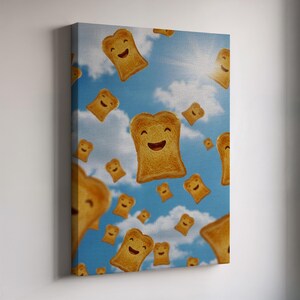 May include: A canvas print featuring a whimsical design of smiling toast slices floating against a blue sky with fluffy white clouds. The toast has a golden-brown color and happy facial expressions.