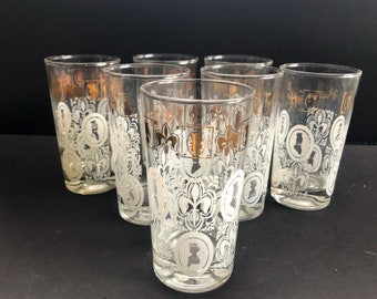 mid century heavy base tumblers set of seven with victorian man and woman and fleur de lis design