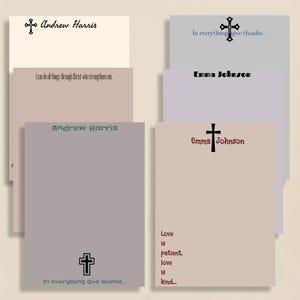 May include: A collection of personalized stationery cards in various pastel colors. Each card features a cross symbol and text, including names like "Andrew Harris" and "Emma Johnson," and inspirational quotes. The cards are arranged in a layered composition.