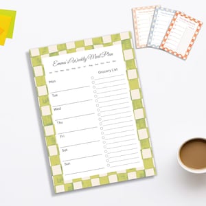 May include: A weekly meal plan notepad with a green and white checkered border. The notepad includes sections for each day of the week and a grocery list. The title "Emma's Weekly Meal Plan" is at the top. Additional notepads in peach, blue, and orange are also visible.