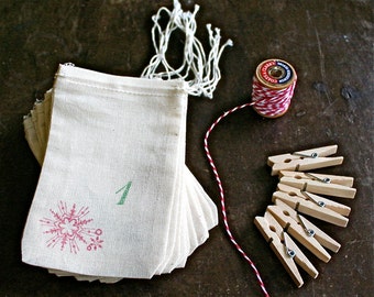 Advent calendar kit, 24 muslin drawstring bags. Reusable advent countdown set, plus baker's twine and clothespins for display.